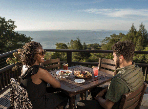 Two Skyland visitors enjoying a meal and a view of Shenandoah National Park