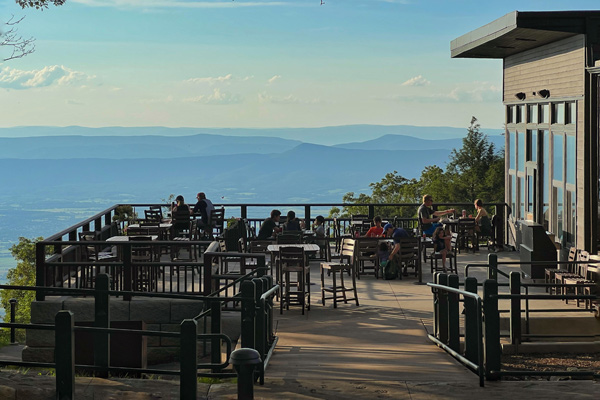 A group of guests dining on the patio at Skyland in Shenandoah National Park