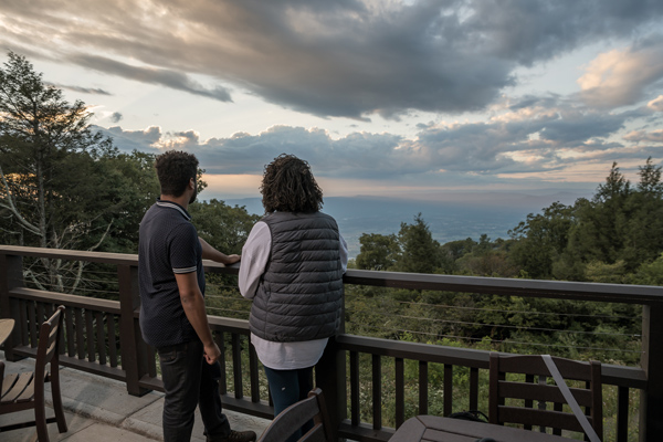 Two guests enjoying the view from the Skyland patio in Shenandoah National Park