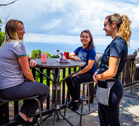 Guests dining on the outdoor terrace at Big Meadows Lodge